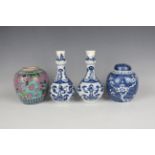 A pair of Chinese blue and white porcelain bottle vases, Kangxi period, each pear-form body with