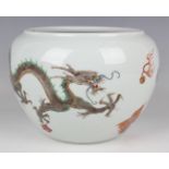 A Chinese famille verte porcelain jardinière of squat globular form, painted with dragons, flaming