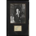 AUTOGRAPHS. An autographed leaf signed by Fred Astaire, mounted and framed with a black and white