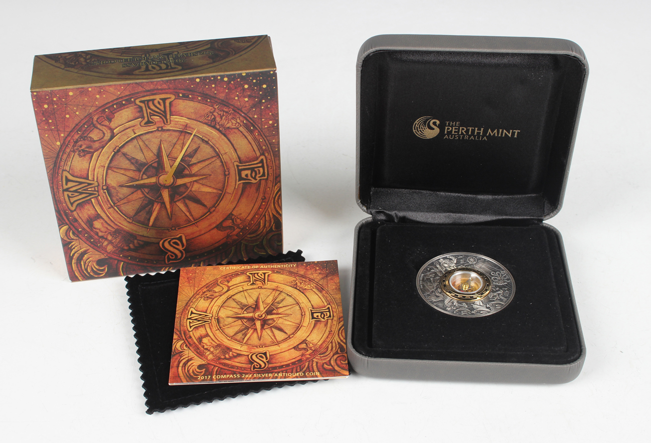 An Australia Perth Mint two-ounce silver novelty compass coin 2017, cased with certificate.Buyer’s