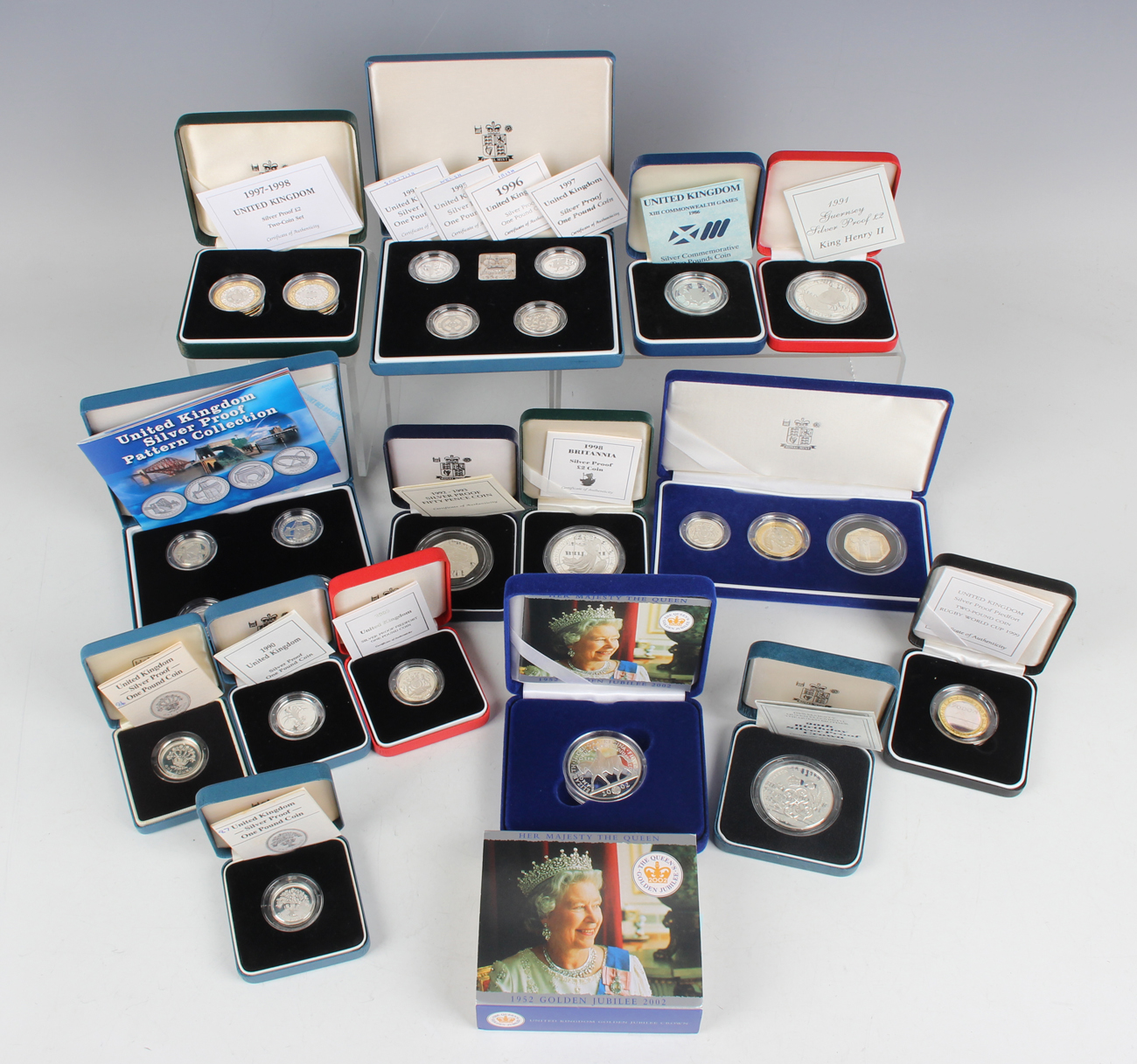 A large collection of Elizabeth II Royal Mint deluxe-format silver proof collectors' coins,