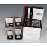 A small collection of cased Royal Mint proof coins, including an All Change 25th Anniversary of