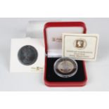 An Elizabeth II Pobjoy Mint gold proof penny black crown, weight 6.22g, cased, and a similar crown-