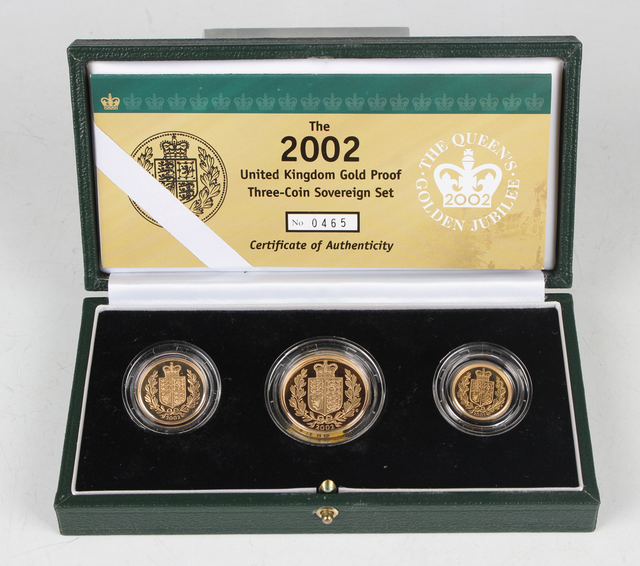 An Elizabeth II Royal Mint gold proof three-coin set 2002, comprising two pounds coin, sovereign and