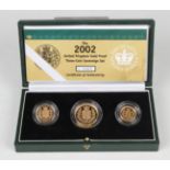 An Elizabeth II Royal Mint gold proof three-coin set 2002, comprising two pounds coin, sovereign and
