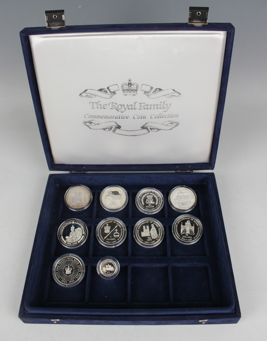 A collection of nine Elizabeth II silver crown-size coins and an Alderney Coronation Anniversary one