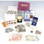 A group of British and world coins and banknotes, including proof coins sets, a group of pre-1947