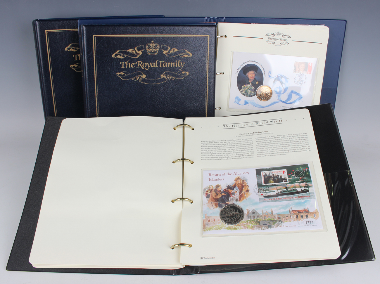 A collection of coin sets and collectors' coin and stamp covers, including The Royal Family in three