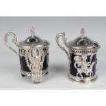 Two early 19th century French silver mustards, each of cylindrical form with hinged lid and pine