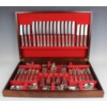 A canteen of plated cutlery, comprising twelve table knives and forks, four tablespoons, twelve