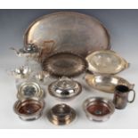 A collection of assorted plated items, including a three-piece tea service, pair of wine coasters
