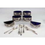 A set of four 19th century French silver oval salts, each embossed and pierced with cornucopia,