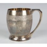 A George V silver christening mug of ovoid form, cast with a band of rabbits amongst leaves and