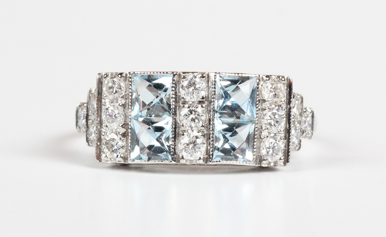 A platinum, aquamarine and diamond ring, mounted with four square cut aquamarines alternating with - Image 5 of 5