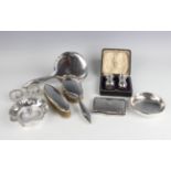 A group of silver, including a pair of pepper casters, Birmingham 1911, cased, a rectangular