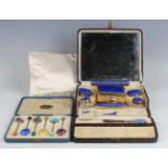 An Art Deco silver gilt and blue enamelled part manicure set, comprising comb, brush, pair of