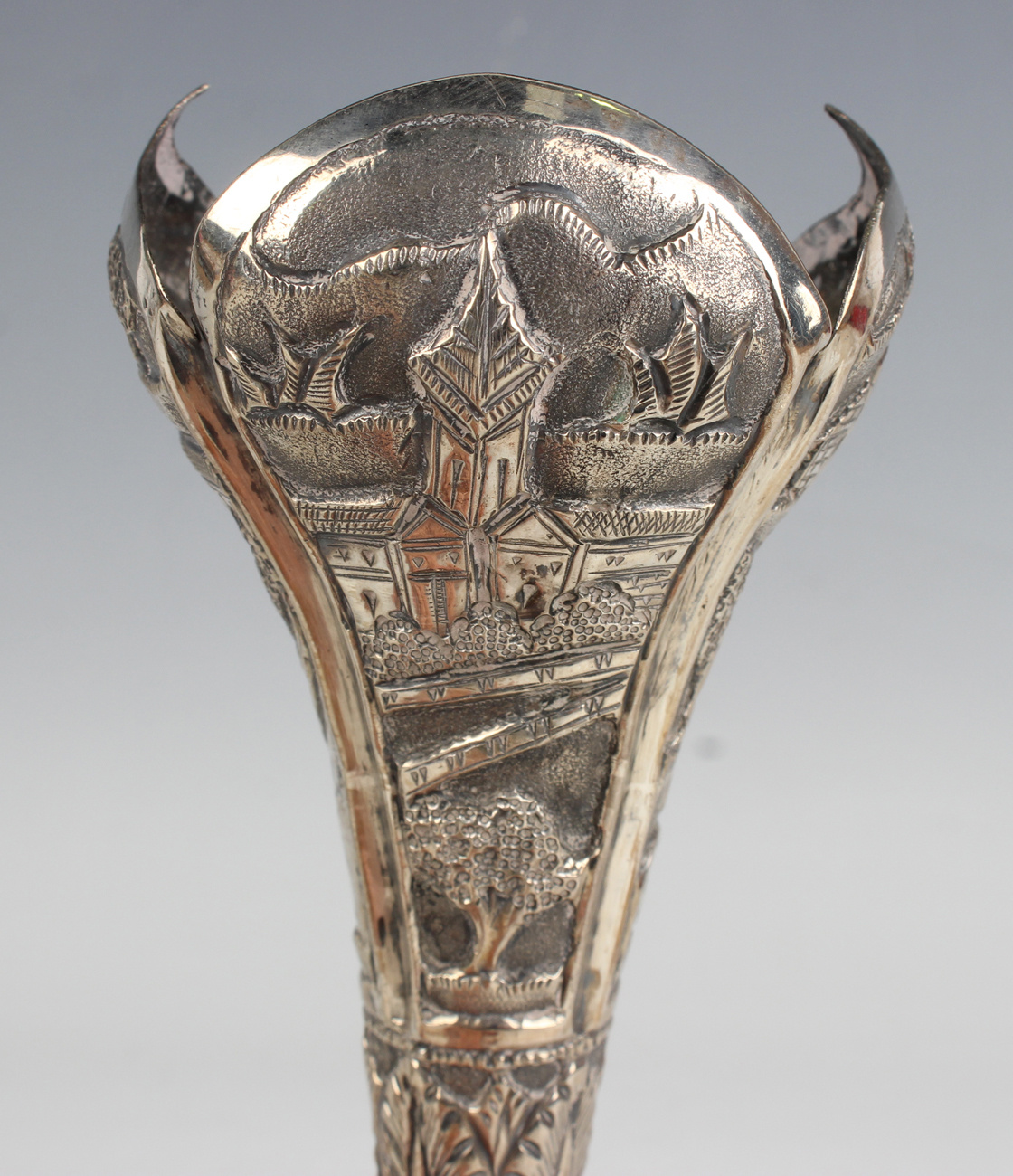 An Indian white metal posy vase, embossed with buildings in landscapes, on a circular foot, height - Image 7 of 10