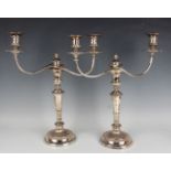 A pair of 19th century Sheffield plate twin scroll branch candelabra, each with detachable nozzles