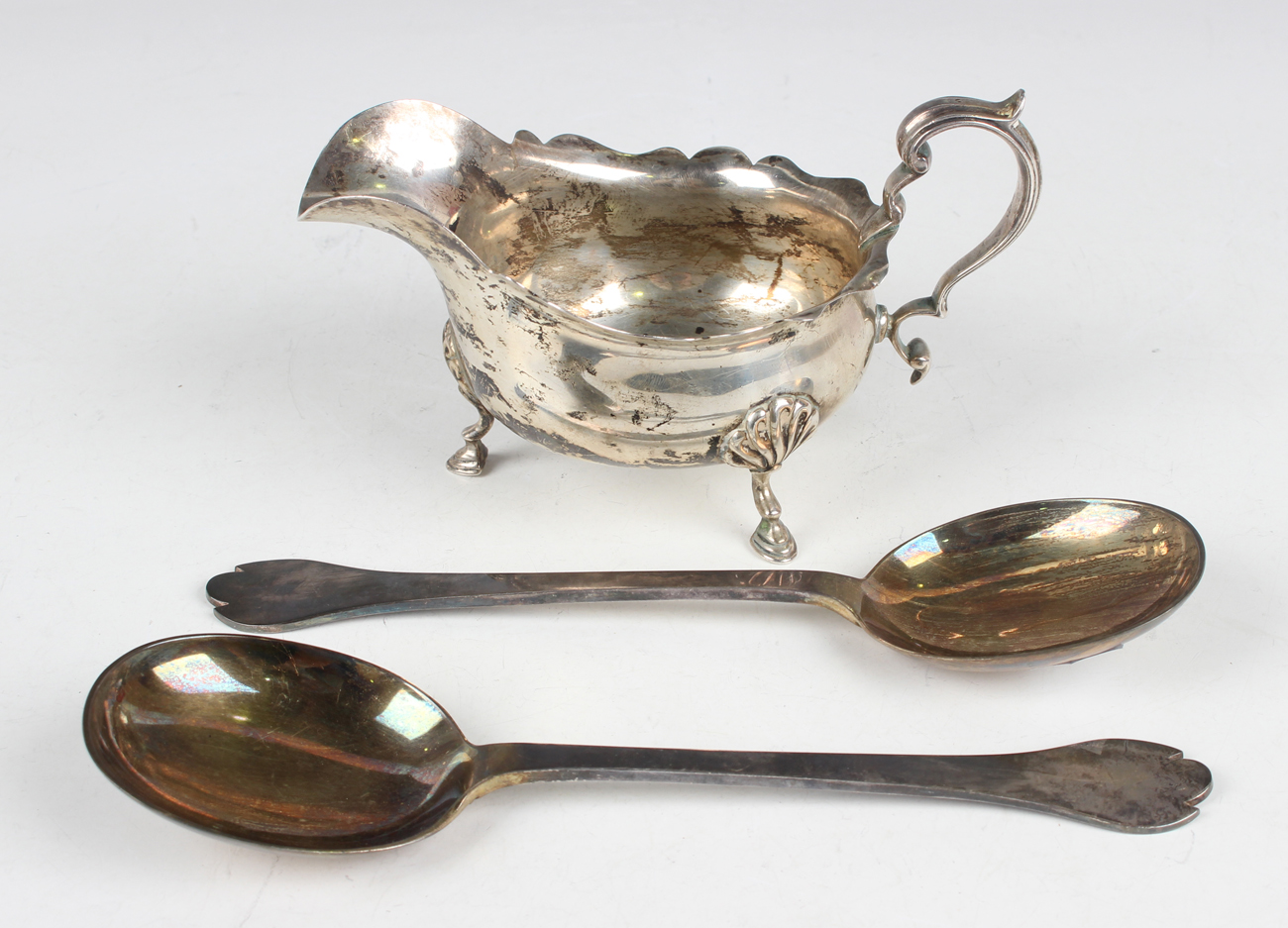 A pair of late 17th century style silver trefid spoons, each with rat tail to bowl back, Sheffield