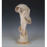 Ernst Seger - a German Art Nouveau carved alabaster figure of a nude maiden holding a billowing robe