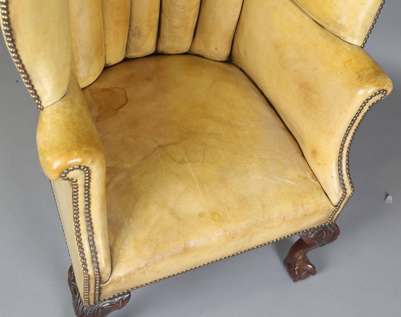 A 20th century George III style armchair, upholstered in studded tan leather, raised on carved - Image 13 of 14