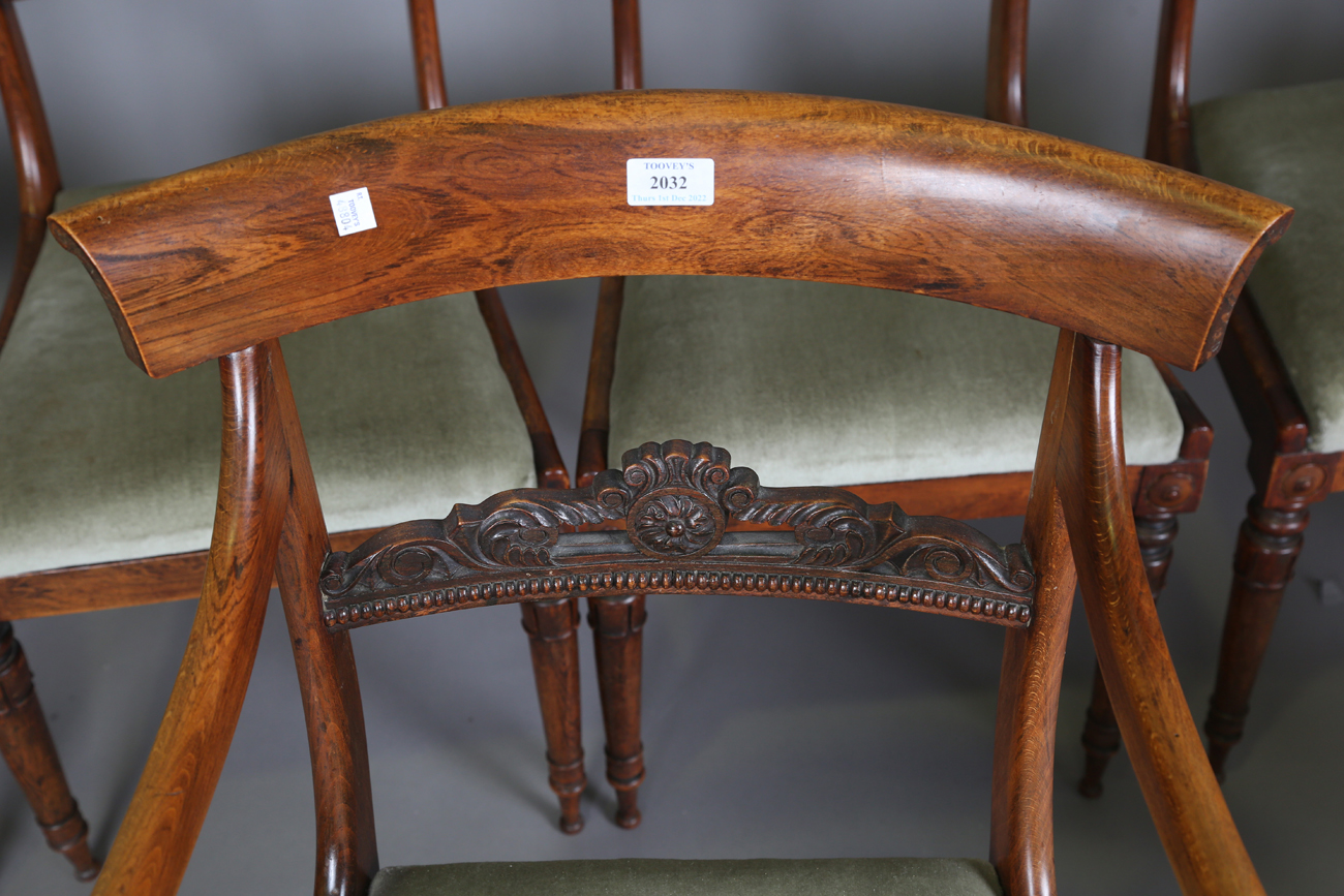 A set of seven Regency simulated rosewood beech framed dining chairs with carved centre rails, - Image 11 of 11