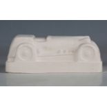 Eduardo Paolozzi - a cast plaster model of a motor car, the underside signed and dated '1997' in