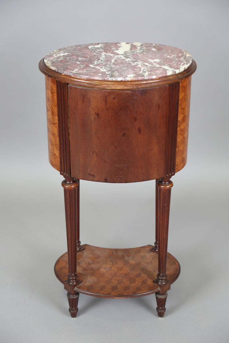 An early 20th century French parquetry kingwood oval bedside cabinet with gilt metal mounts and - Image 3 of 11