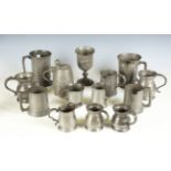A collection of mainly 19th century pewter, including a spouted quart tankard, another quart tankard