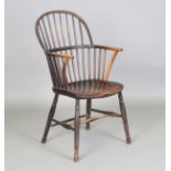 A 19th century fruitwood and elm stick back Windsor armchair, height 100cm, width 53cm, depth 58cm.