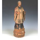 A late 18th/early 19th century European lacquered papier-mâché and painted softwood figure of a