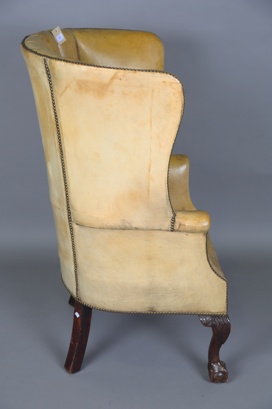 A 20th century George III style armchair, upholstered in studded tan leather, raised on carved - Image 9 of 14