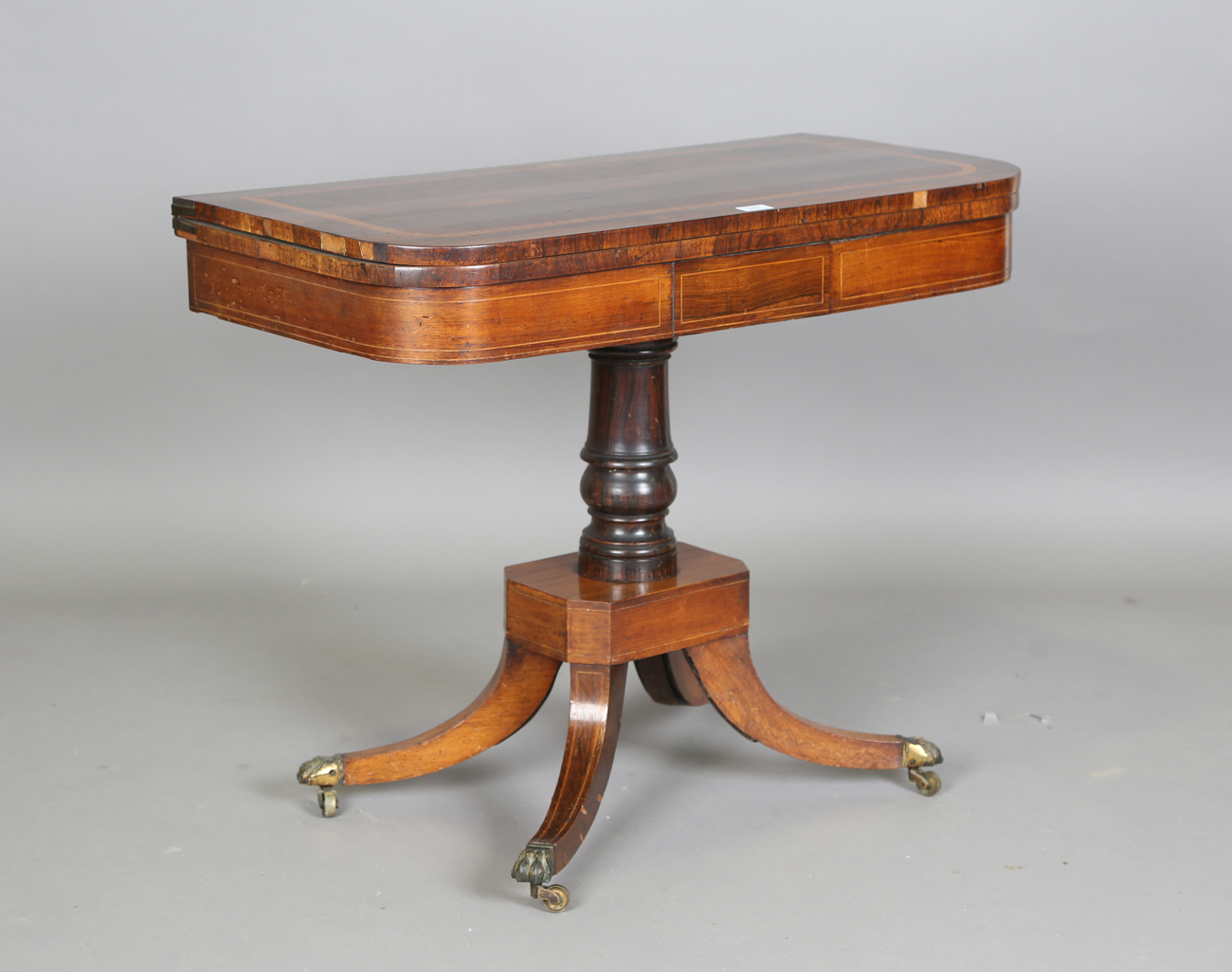 A Regency rosewood and satinwood crossbanded fold-over card table, height 73cm, width 91cm, depth