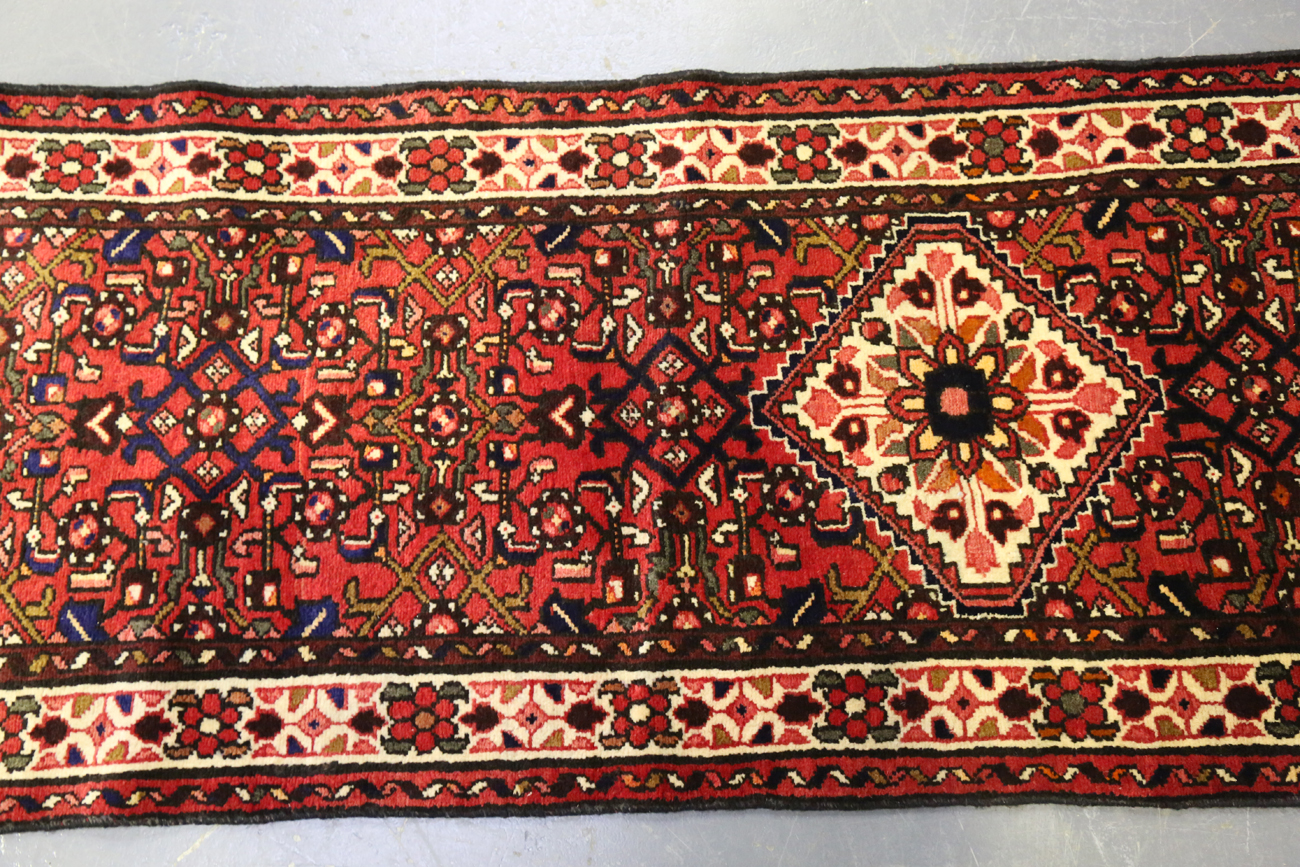A Malayer runner, North-west Persia, mid/late 20th century, the red field with an overall floral - Image 6 of 9