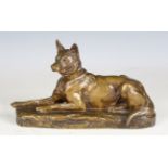 Louis Riche - a 20th century French patinated bronze model of a recumbent Alsatian, cast signature