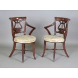 A pair of Regency style mahogany music chairs, possibly Irish, each bar and lyre back above an