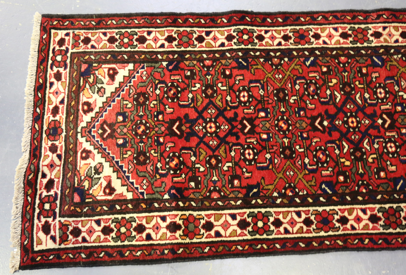 A Malayer runner, North-west Persia, mid/late 20th century, the red field with an overall floral - Image 8 of 9