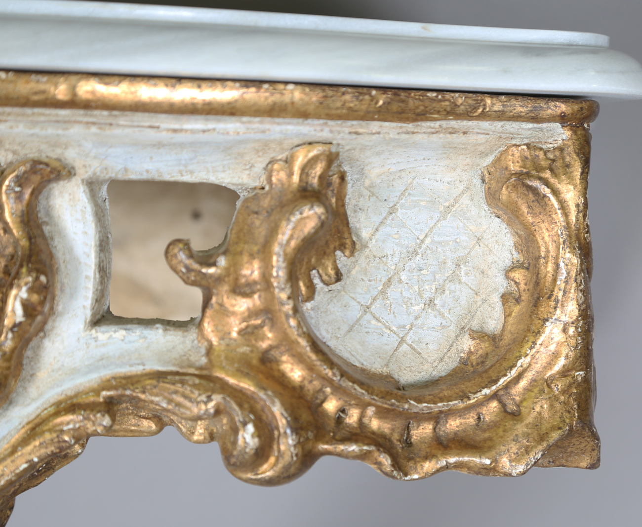 A pair of modern Rococo style white and gilt painted carved wooden console tables with shaped - Image 9 of 15