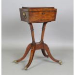 A Regency figured mahogany and ebony inlaid teapoy, the sarcophagus caddy top enclosing four