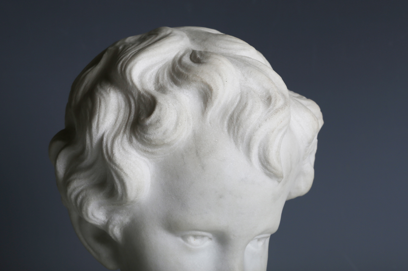 An early 20th century carved marble bust of a young boy, unsigned, height 24cm.Buyer’s Premium 29.4% - Image 8 of 9