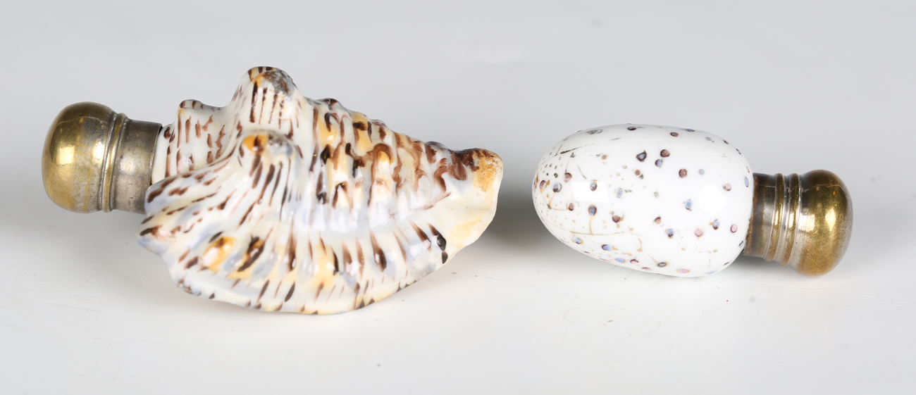 A late 19th century porcelain novelty scent bottle, modelled and painted as a seashell, length 7.