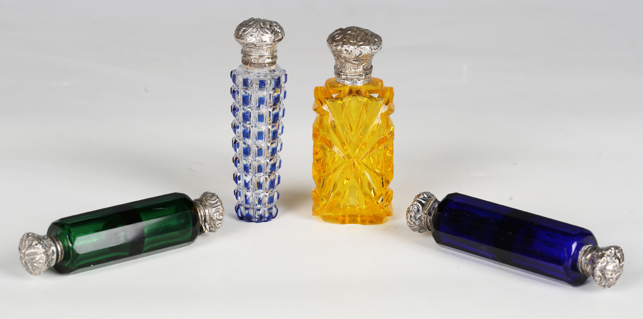 A late 19th century yellow cut glass scent bottle with silver hinged lid, length 9cm, two coloured