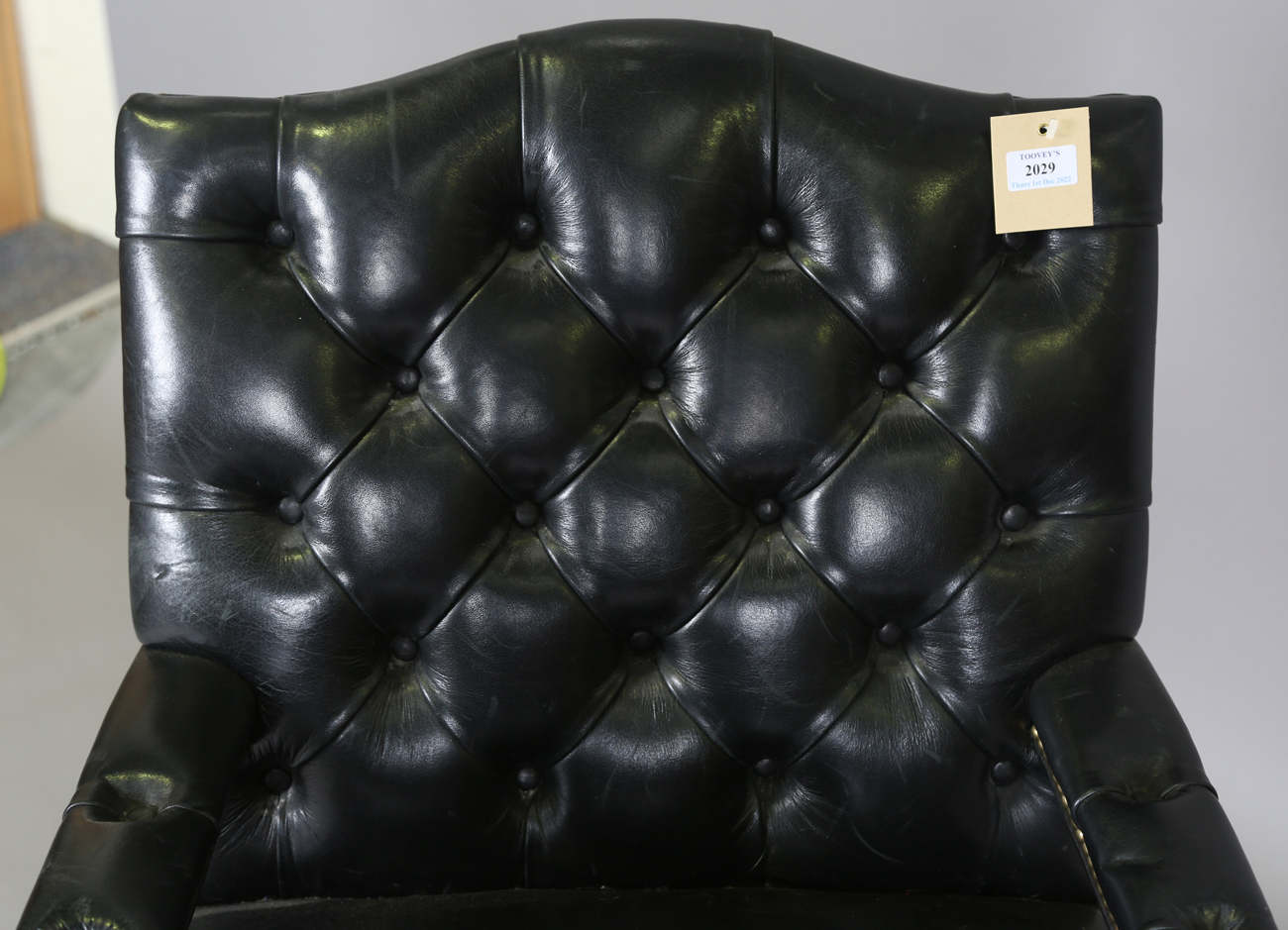 A late 20th century revolving desk chair, upholstered in buttoned black leather, height 95cm, - Image 10 of 11