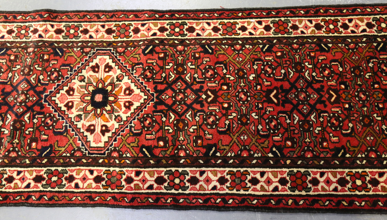 A Malayer runner, North-west Persia, mid/late 20th century, the red field with an overall floral - Image 4 of 9