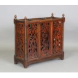 A late Victorian walnut three-division stick stand with pierced fretwork panels, height 76cm,