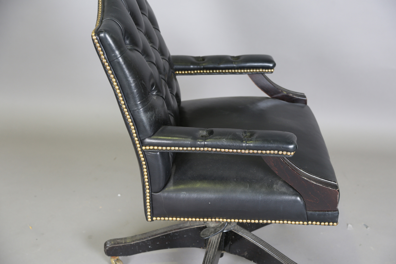 A late 20th century revolving desk chair, upholstered in buttoned black leather, height 95cm, - Image 7 of 11