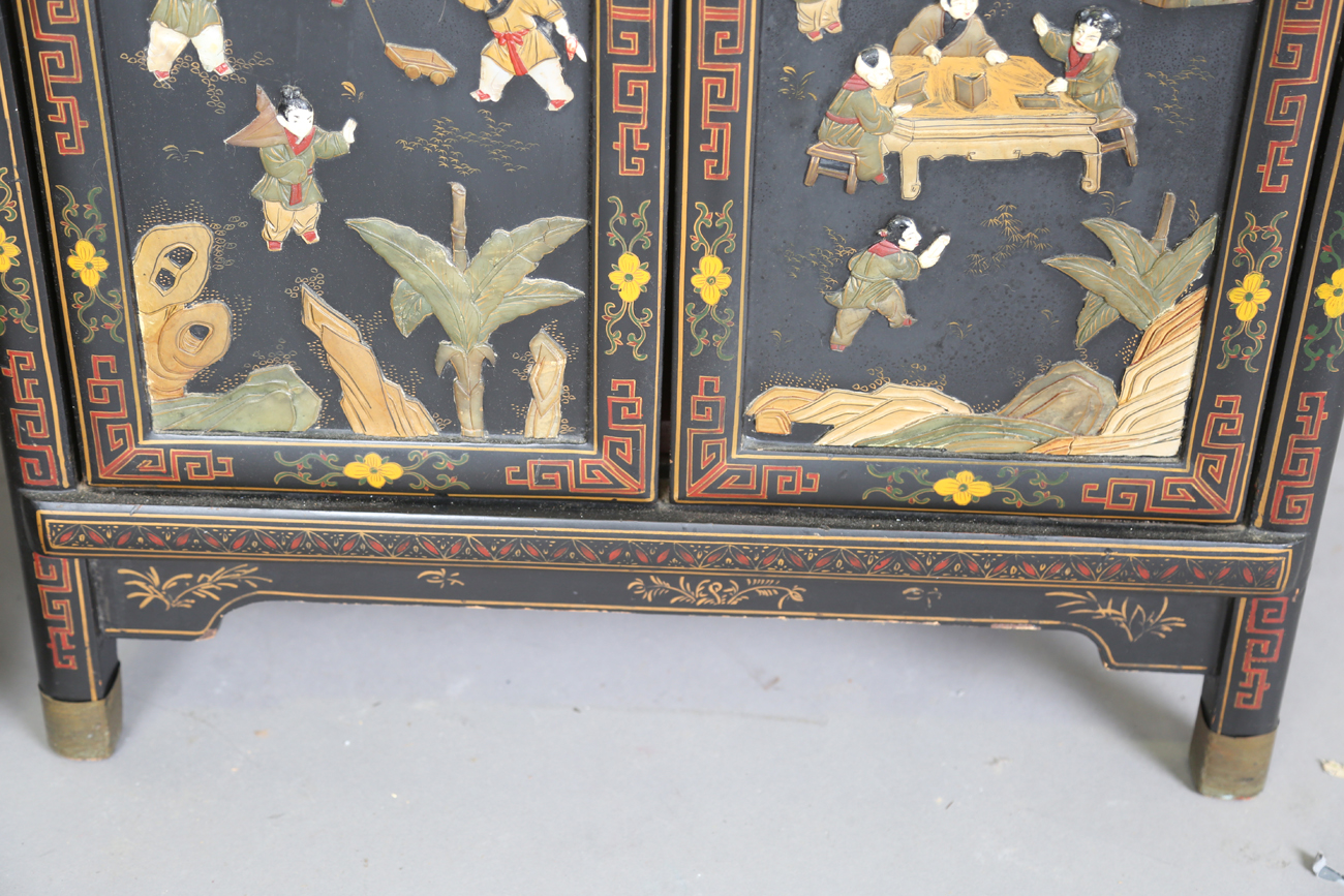 A pair of 20th century Chinese black lacquered and hardstone inlaid side cabinets, each door - Image 15 of 18