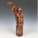 A mid-20th century Chinese carved hardwood figure of Shou Lao, modelled holding a peach, height 55.