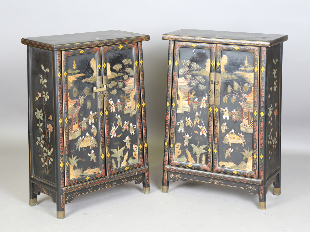 A pair of 20th century Chinese black lacquered and hardstone inlaid side cabinets, each door