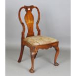 A Queen Anne walnut vase back side chair, the top rail carved with a scallop shell and